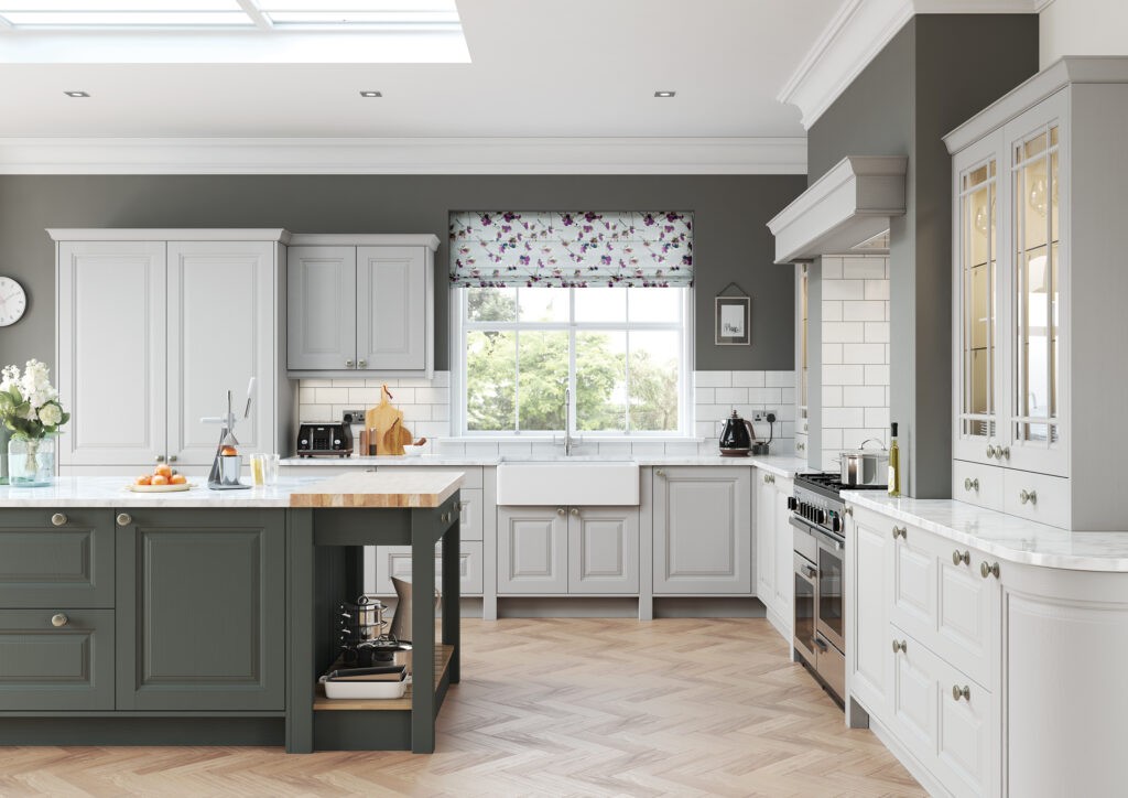 Grey shaker kitchen with sage green island, marble worktops and herringbone flooring