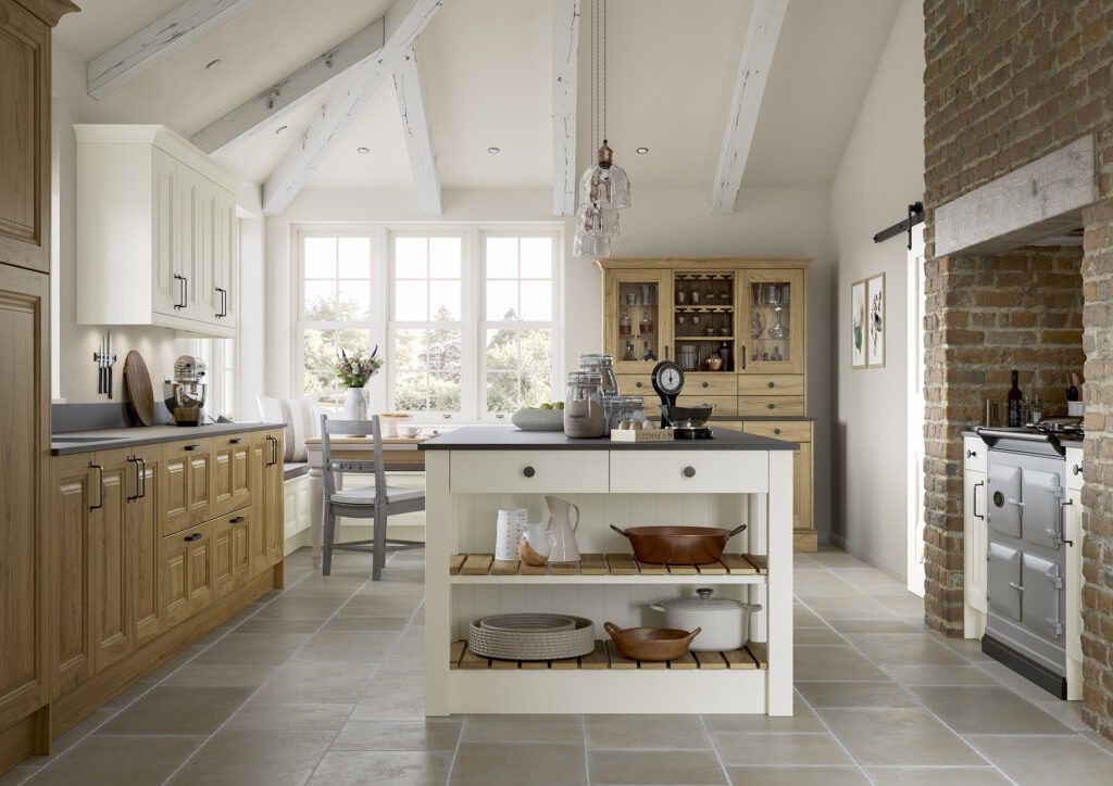 Cream shaker kitchen with exposed white beams, oak island and Aga-style cooker